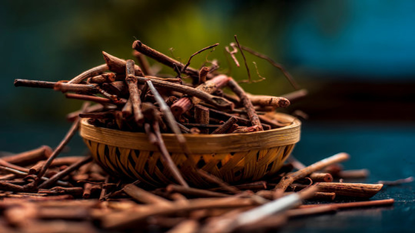 Dried Manjistha roots in a bowl showing manjistha benefits for skin in Ayurvedic care.