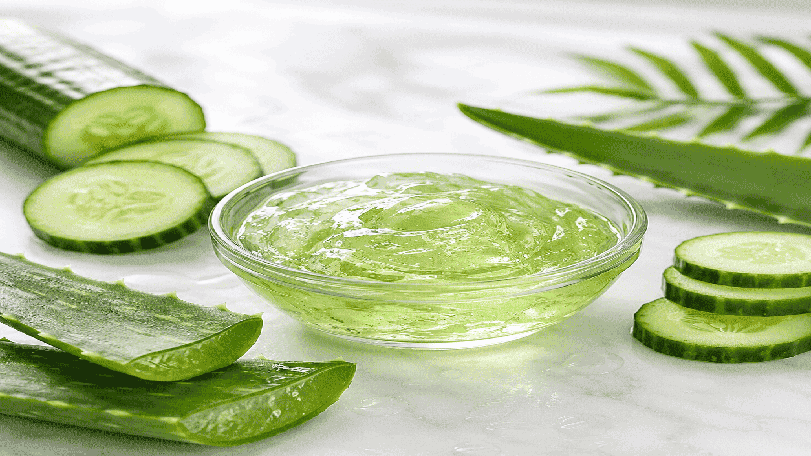 Natural aloe vera cucumber gel with fresh cucumber slices and aloe vera leaves.